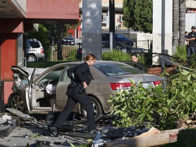Police officers assess an accident.