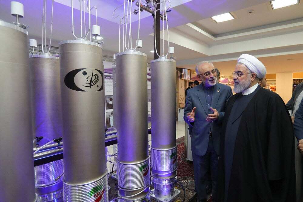Iranian President Hassan Rouhani (R) inspecting nuclear technology on the occasion of Iran National Nuclear Technology Day in Tehran, Iran, 9 April 2019