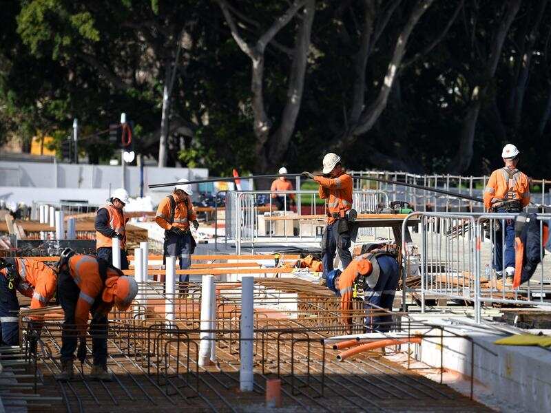 Construction workers continue work on the Sydney Light Rail project