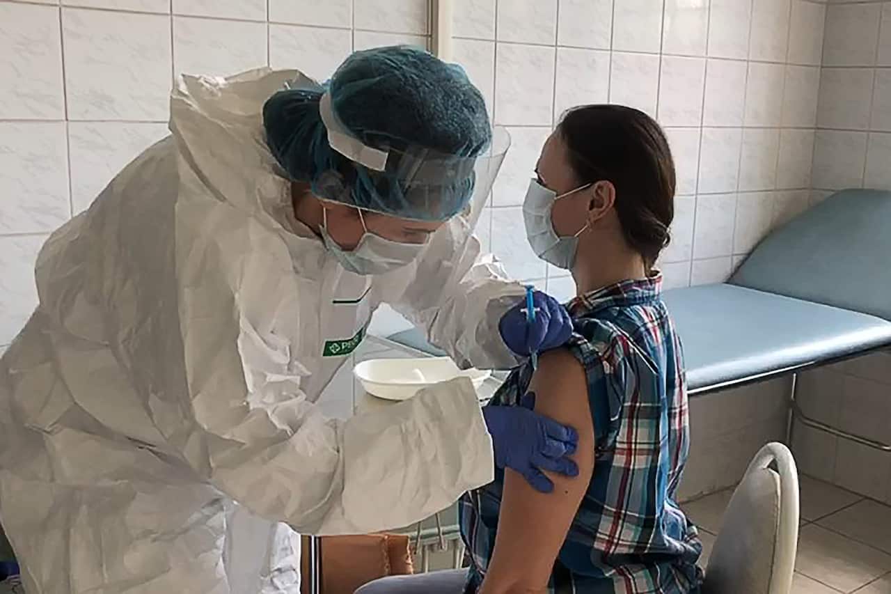 A volunteer receiving a Russian-made COVID-19 as part of clinical trials in Moscow, June 2020.