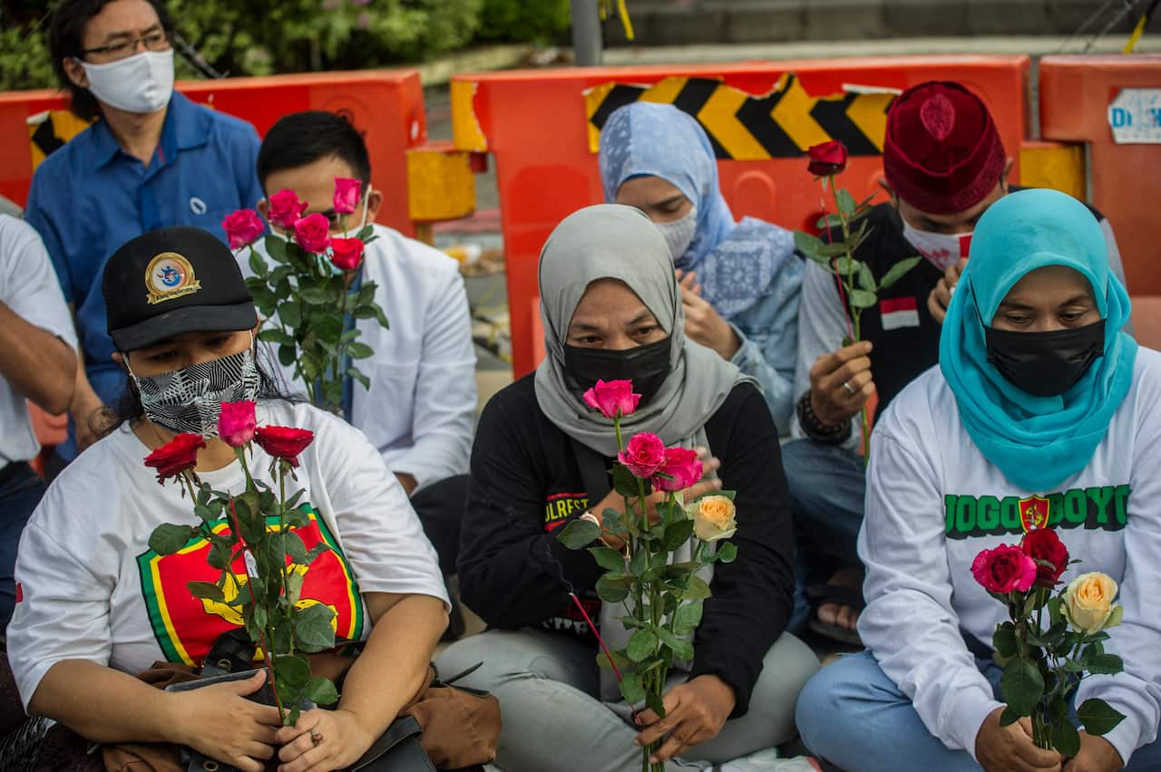 People from various religions gather in Surabaya to offer prayers for the 53 sailors who were in the submarine, on 25 April, 2021.
