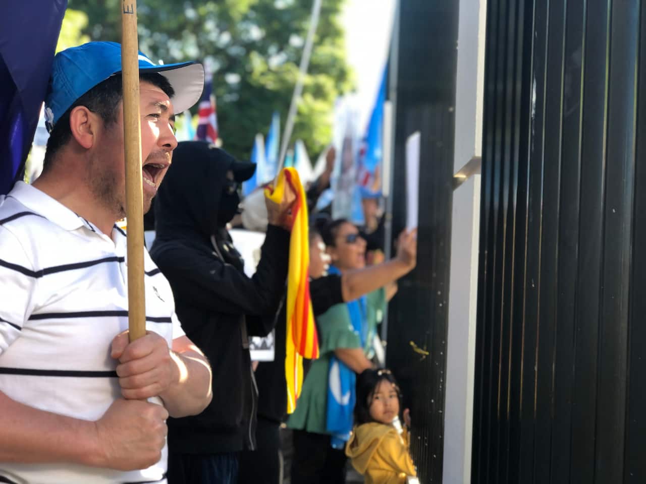 Protestors outside the new consulate. 