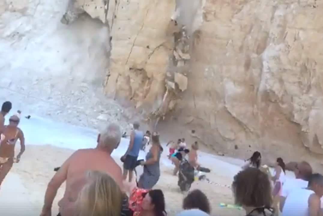 Undated handout photo taken with permission from the Facebook page of Josh O&OtildeConnell, of tourists on the Greek island of Zante scrambling to safety