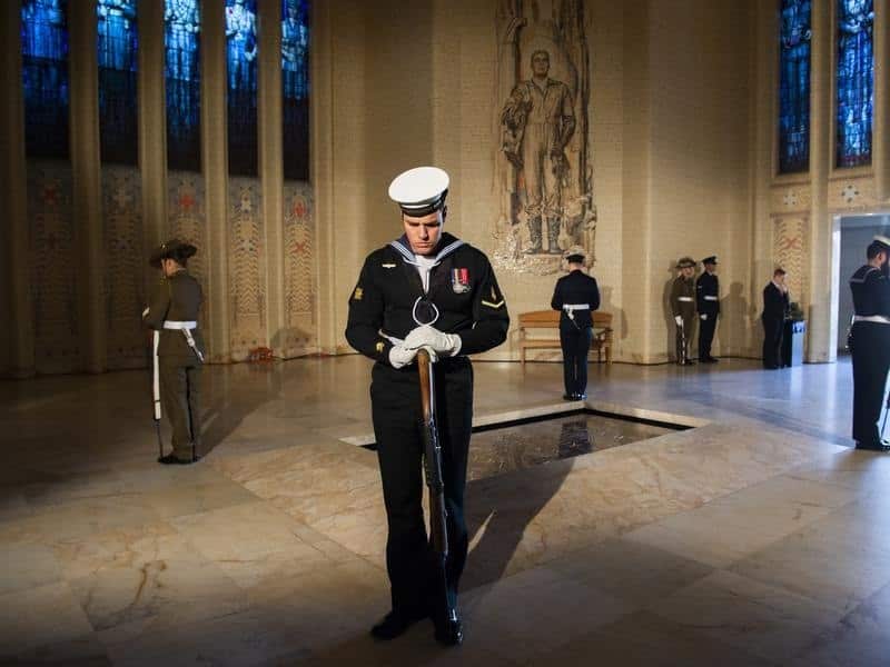 Soldiers guard the tomb of the unknown soldier at the War Memorial.
