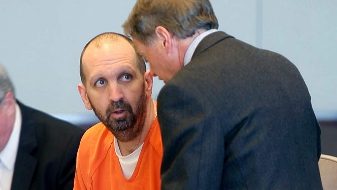 Craig Hicks, charged with the murder of three Muslim students in Chapel Hill, N.C., sits with attorneys Terry Alford, left, and Steve Freedman.
