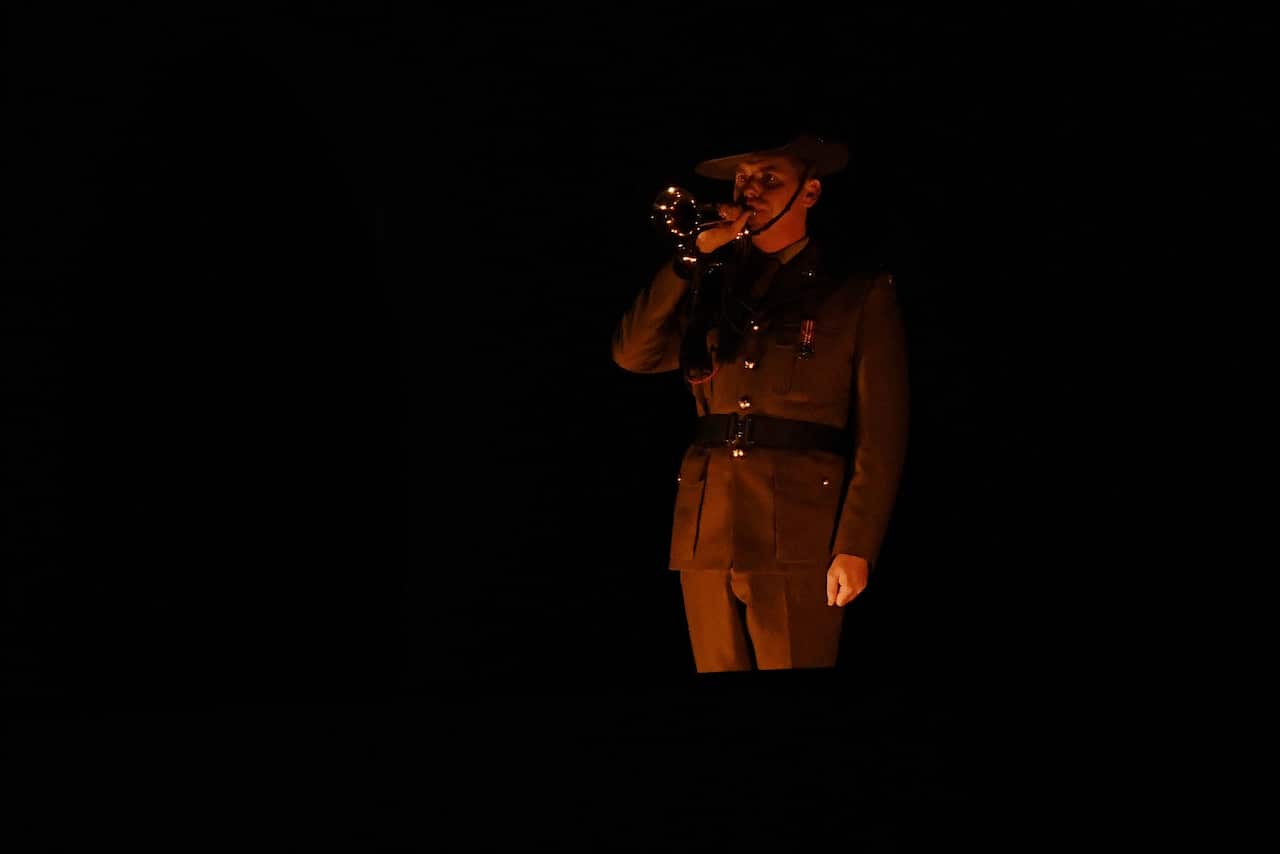 A member of the Australian Defence force is seen playing the last post at the Australian War Memorial on Anzac Day 2017