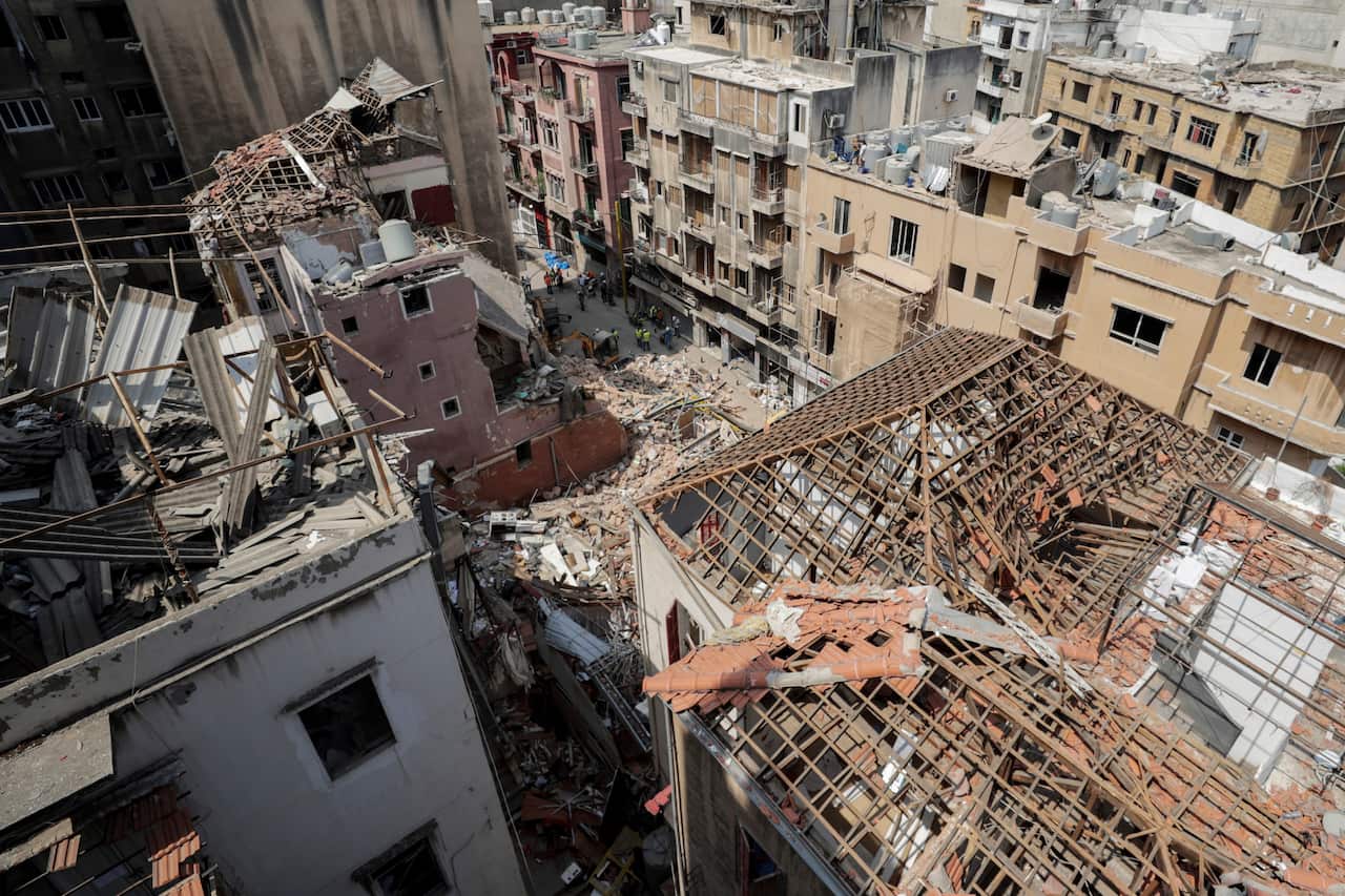 A general view shows rescuers search at the site of a collapsed building after getting signals there may be a survivor under the rubble in Beirut, Lebanon.