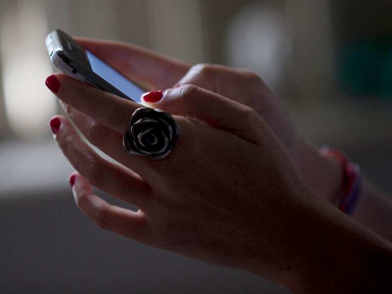 A woman uses her smartphone