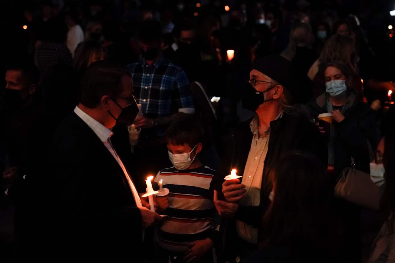 People attend a candlelight vigil to honor cinematographer Halyna Hutchins in Albuquerque, Saturday, 23 October, 2021. 