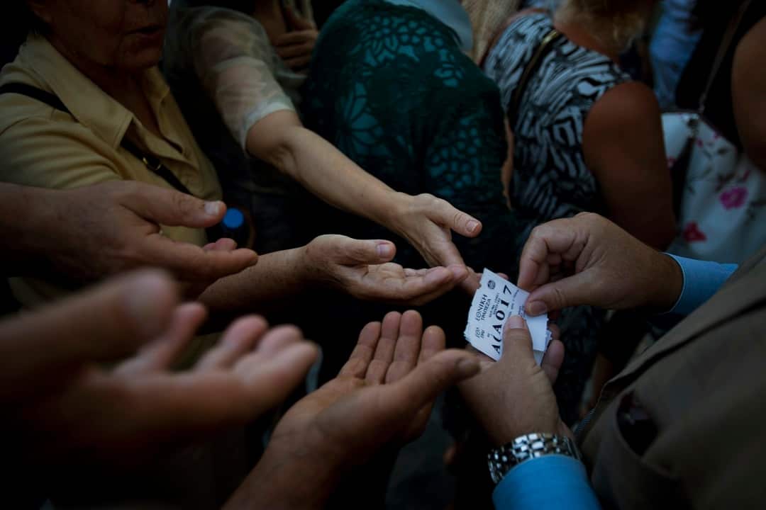 A file photo of queue tags given to seniors who are lining up to withdraw a per-person maximum of 120 euros for the week in central Athens.