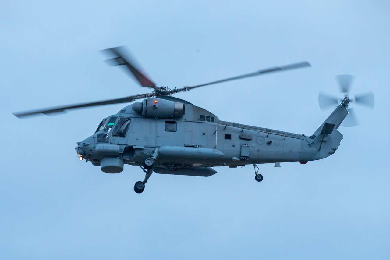 A military helicopter arrives at Whakatane airport prior to a recovery operation to retrieve the remaining bodies on White Island.