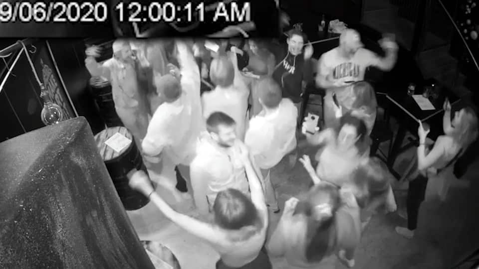 In pubs around the country, Kiwis leapt up to embrace each other when the restrictions eased on the stroke of midnight .