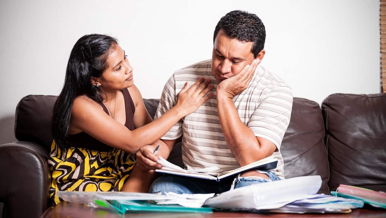 Couple dealing with financial or legal difficulties