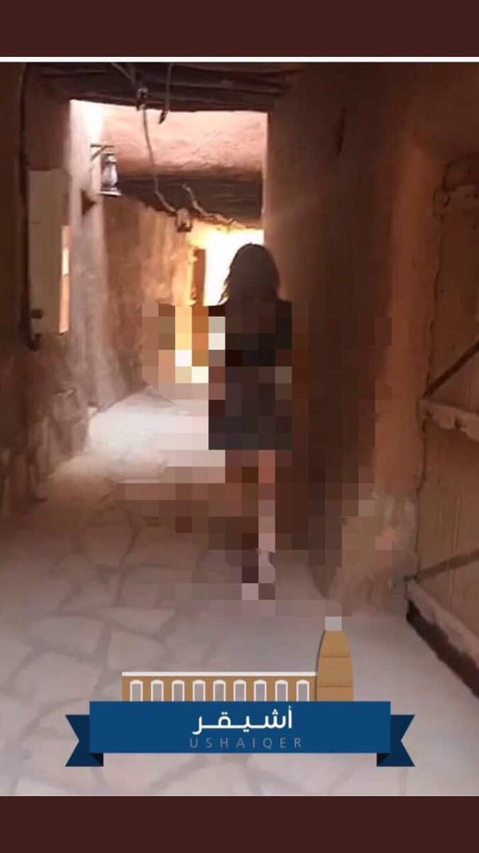 A pixelated photo of a woman with bare arms and legs in Saudi Arabia