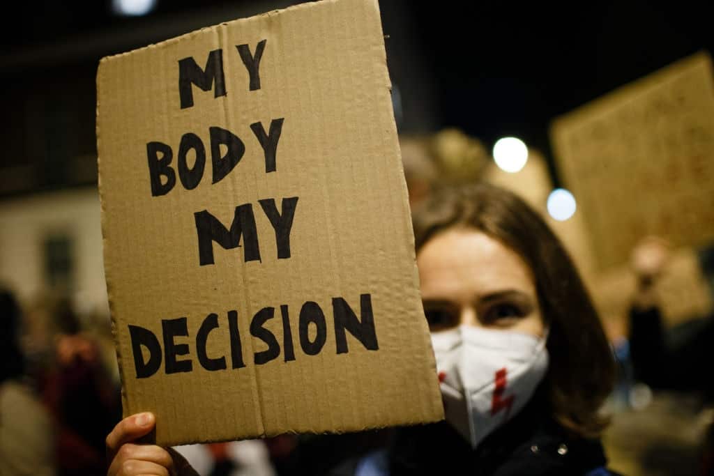 Opponents of Poland's new abortion restrictions demonstrate outside the Polish Embassy on Portland Place in London.