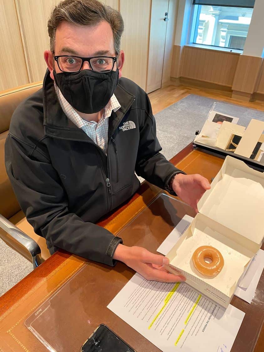 Victorian Premier Daniel Andrews treats himself with a donut.