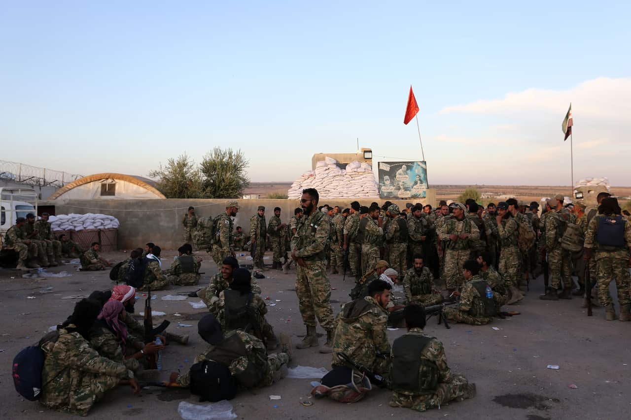 Pro-Turkish Syrian fighters gather near the town of Azaz in Syria's northern Aleppo province.