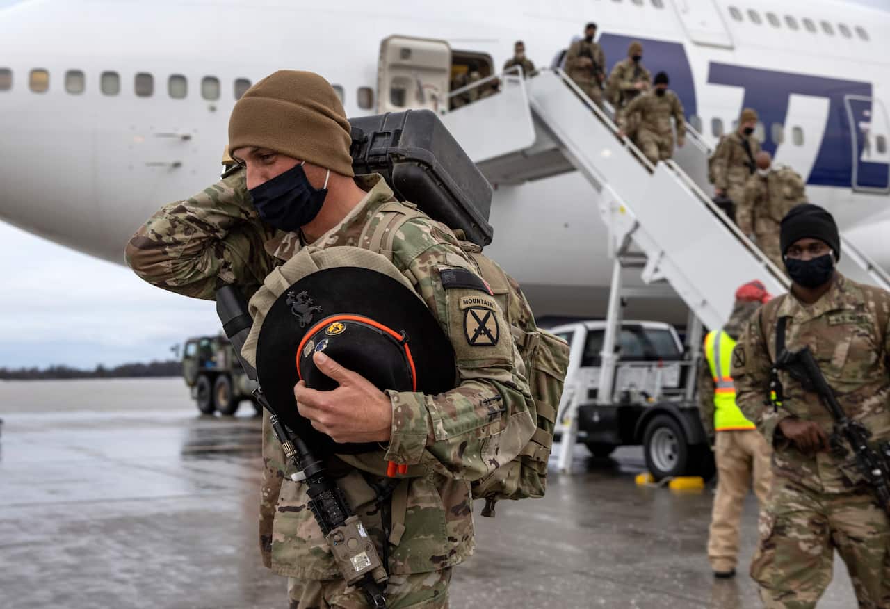 US Army soldiers return home from a nine-month deployment to Afghanistan on 10 December, 2020 at Fort Drum, New York.