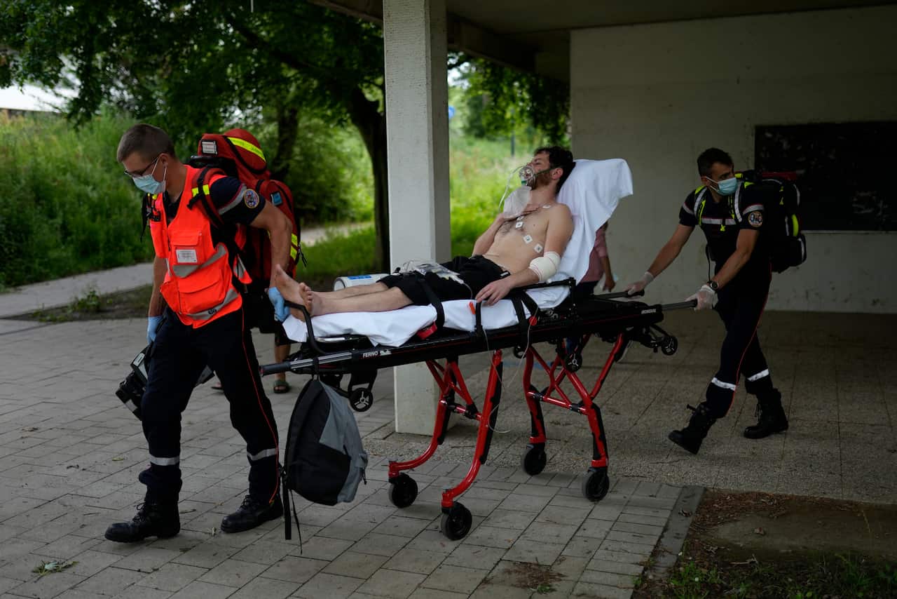 A man on hunger strike is transferred to a hospital as he occupies with others a big room of the ULB Francophone university in Brussels, Tuesday, June 29, 2021