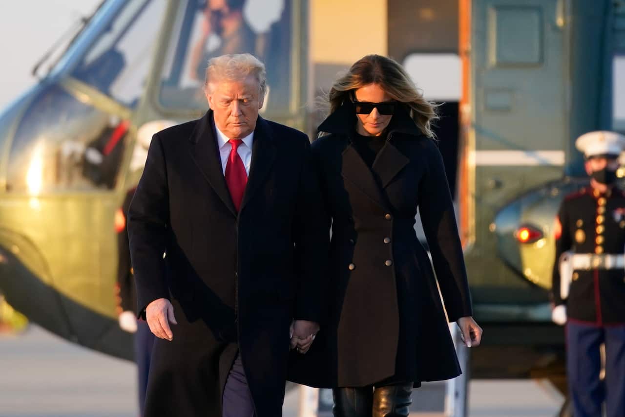 President Donald Trump and first lady Melania Trump board Air Force One at Andrews Air Force Base, 23 December, 2020. 