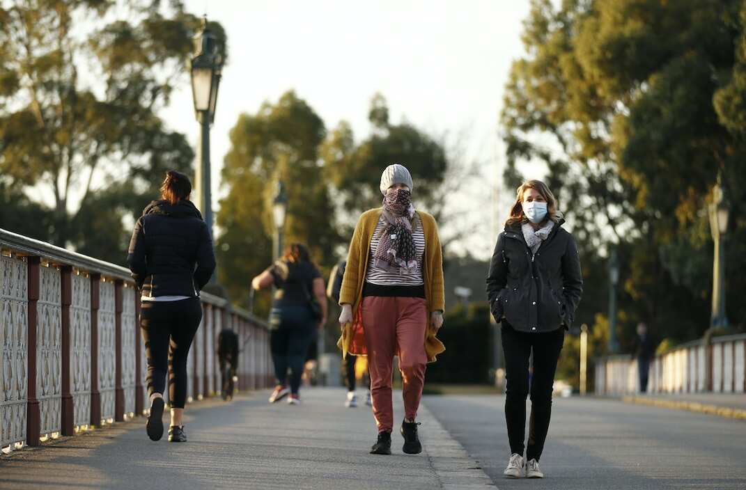 People wear masks in Melbourne.