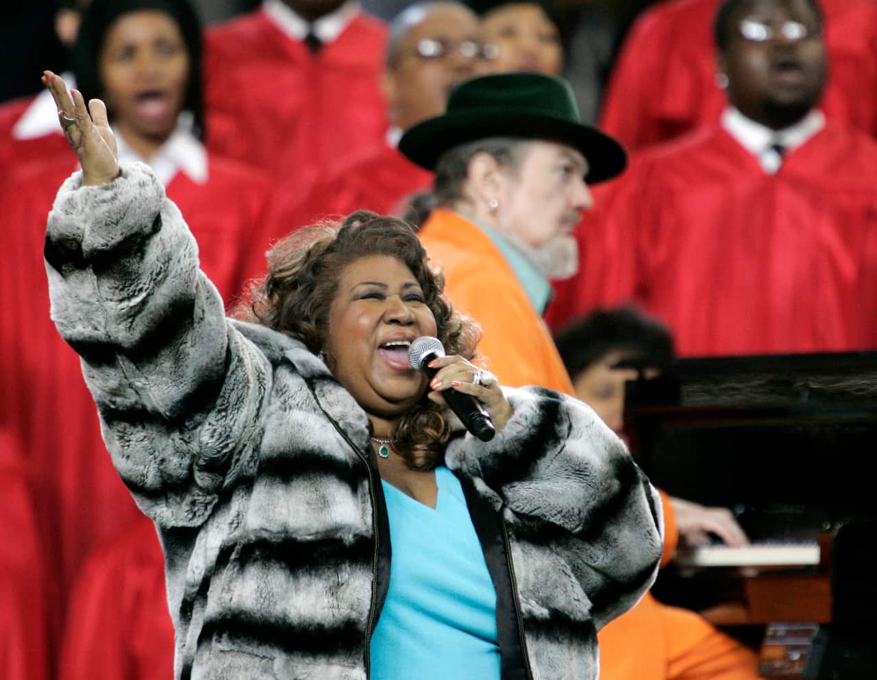 Feb. 5, 2006 file photo, Aretha Franklin and Dr. John, background on piano, perform the national anthem before the Super Bowl XL football game in Detroit. 