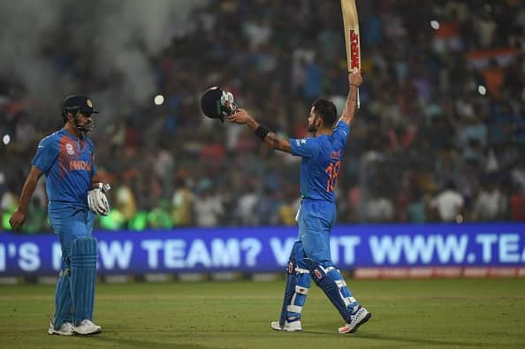 India's Virat Kohli(R)celebrates with captain Mahendra Singh Dhoni after victory in the World T20 cricket tournament match between India and Pakistan
