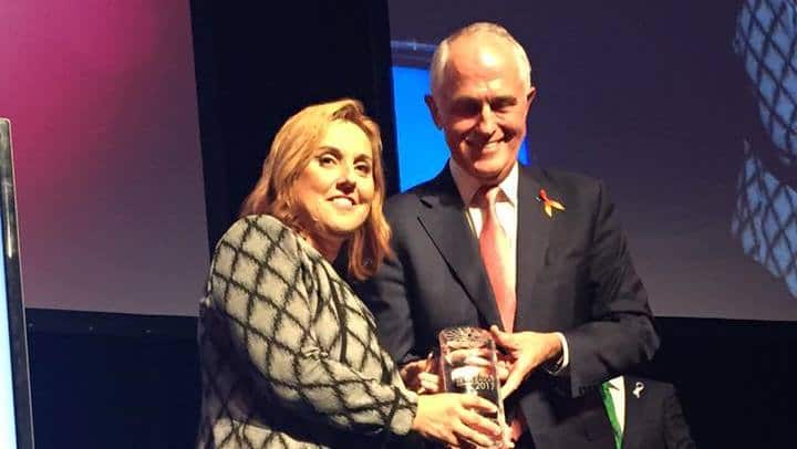 Greek-Australian human right legal advocate Maria Dimopoulos receiving Migration Council's "Lifetime Achievement Award" from Australian PM Malcolm Turnbull