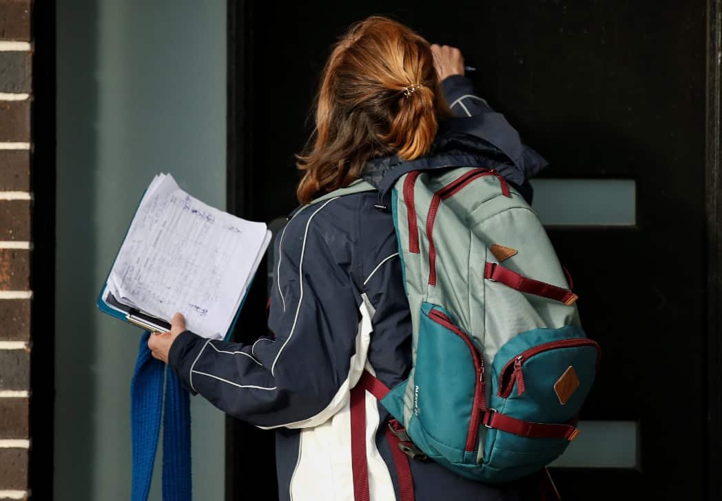 Victoria State Government Health and Human Services people knock on doors in Broadmeadows to check if people have any symptoms.