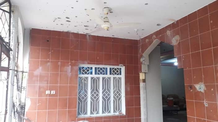 The roof of the house damaged by the sharpnels of bomb.