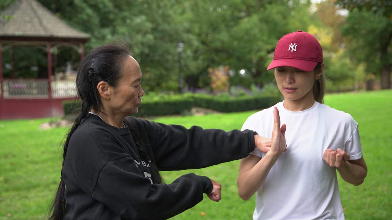 Kung Fu instructor Anne Pang with her student. 