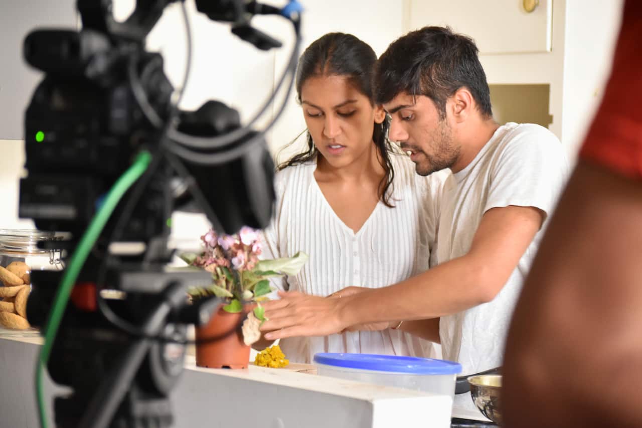 Actress Ria Patel and Director Jay Parikh during the filming of Varta re Varta 