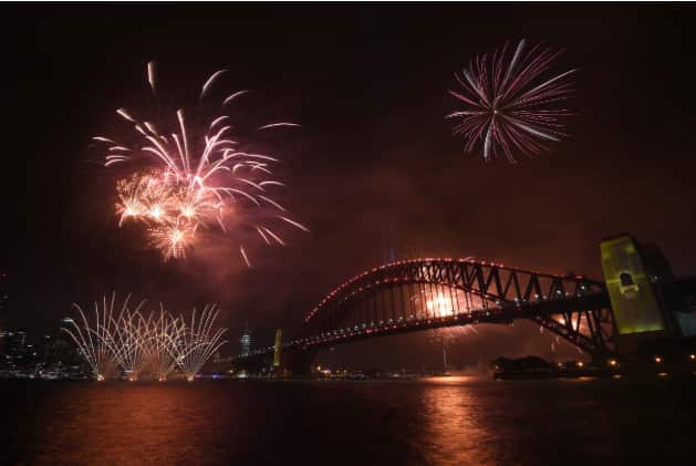 Fireworks explode above the Sydney Harbour Bridge. AAP
