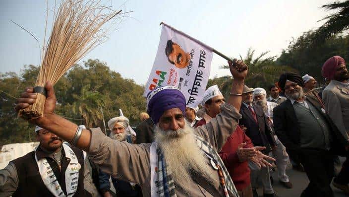 Aam Aadmi Party supporter hold broom