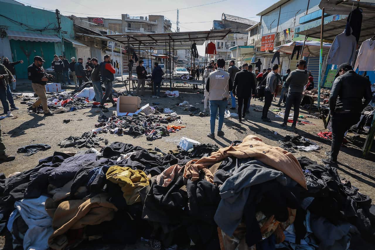 A rare twin suicide bombing killed 32 people and wounded 110 at a crowded market in central Baghdad on Thursday, Iraq's government said.