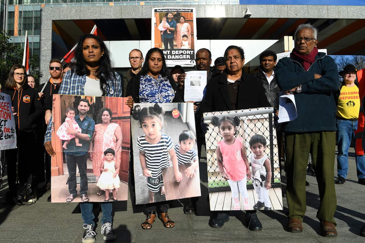 Supporters of the Biloela Tamil family gather outside the Federal Court in Melbourne.