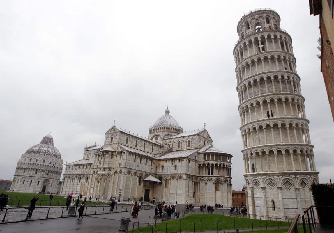 The Leaning Tower of Pisa is next to the medieval cathedral of Pisa in Piazza dei Miracoli Square