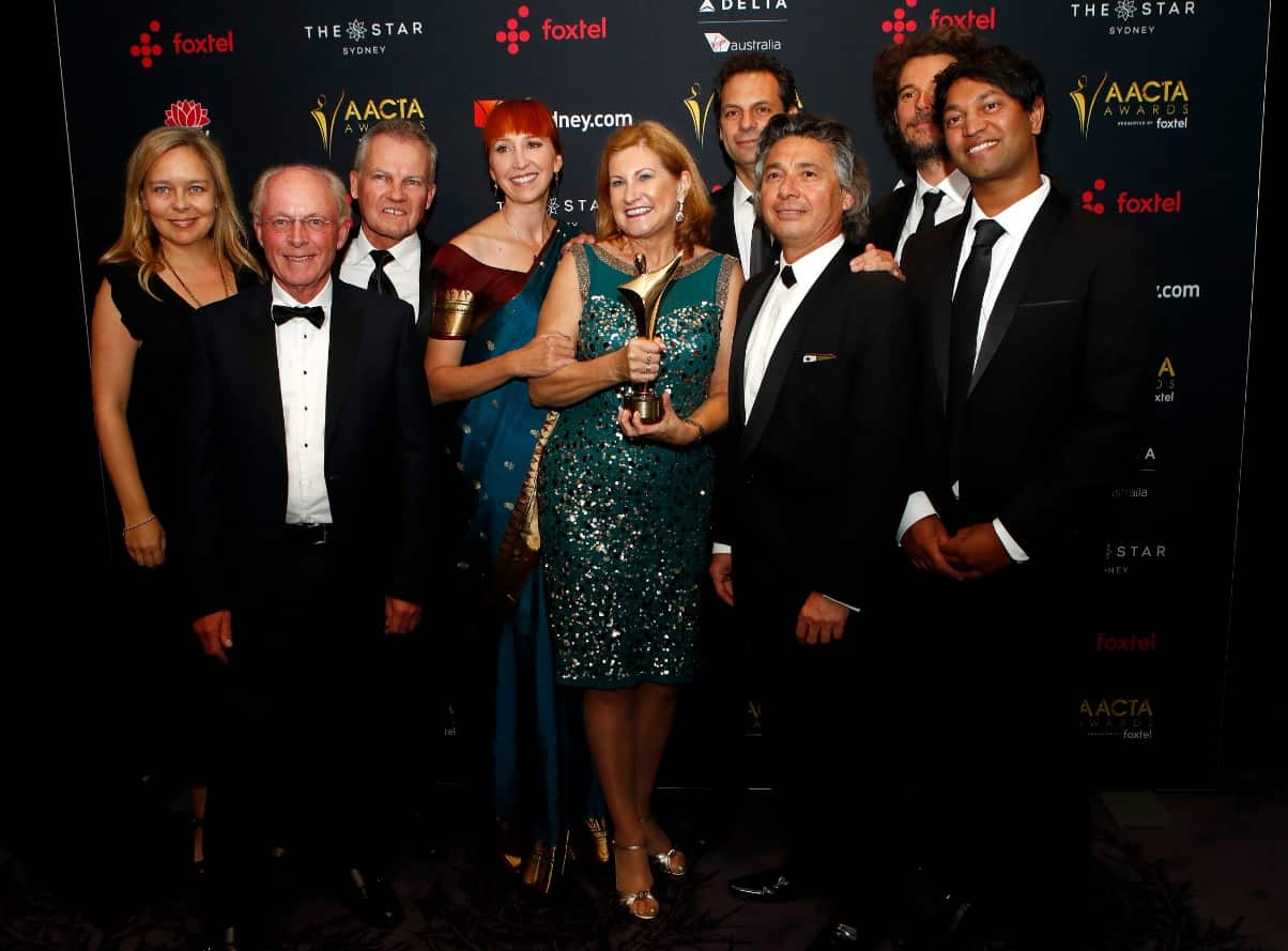 Lion cast and crew pose with the AACTA Award for Best Film.
