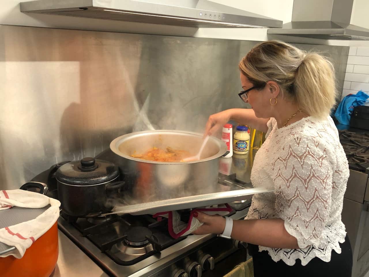 Church member Zara prepares for the dinner service following church