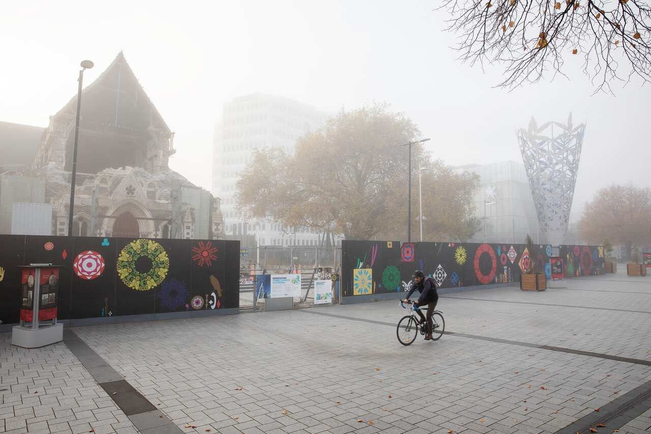 A man rides past the usually crowded Cathedral Square during the COVID-19 alert level 4 lockdown in Christchurch, New Zealand.