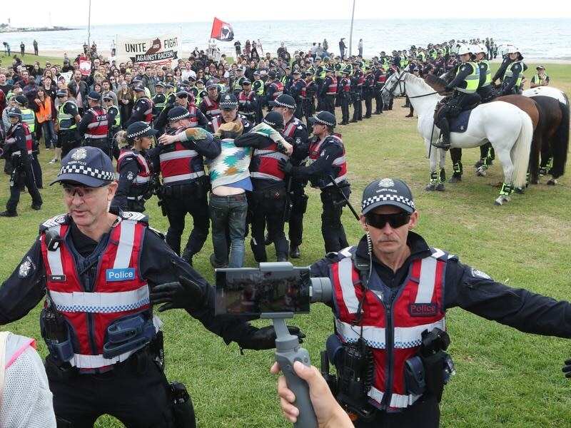 Police keep protesters apart on St Kilda foreshore