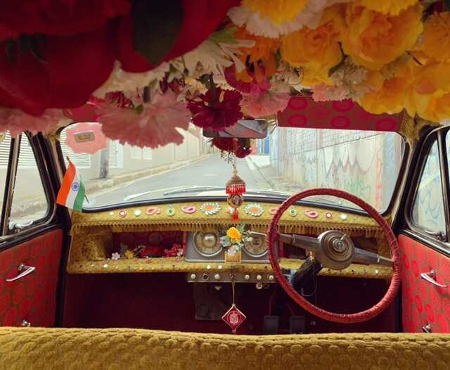 People use 'Bollywood Car', a black and yellow taxi cab in Sydney for various purposes.