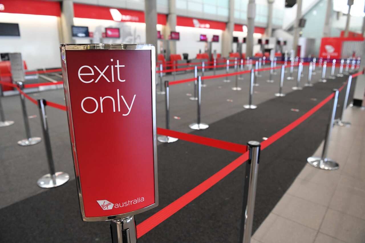 An empty Virgin Australia check-in area at Brisbane domestic airport