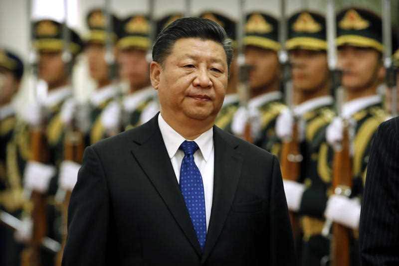 Chinese President Xi Jinping reviews an honor guard during a welcome ceremony at the Great Hall.