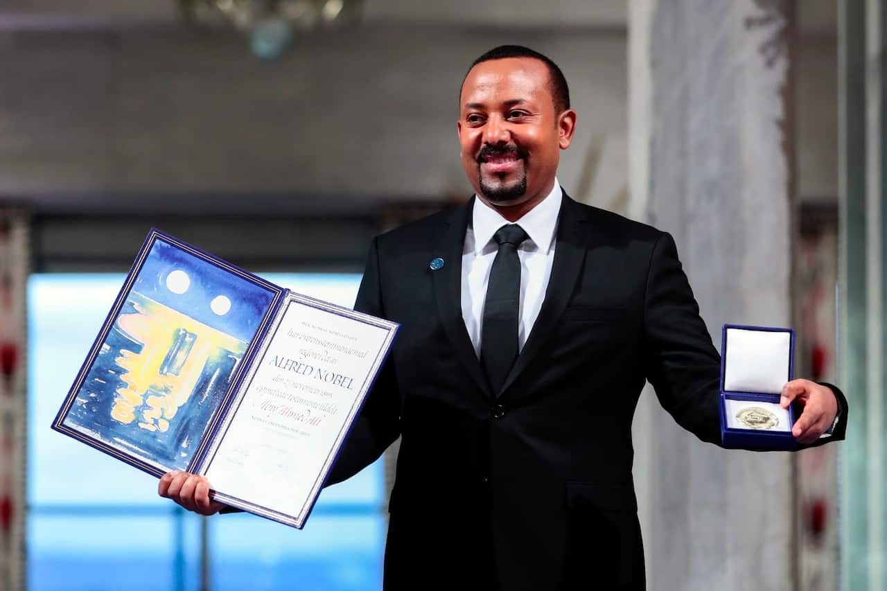 Ethiopia's Prime Minister Abiy Ahmed poses for the media after receiving the Nobel Peace Prize during the award ceremony in Oslo City Hall, Norway, Tuesday Dec. 10, 2019. (HÃ¥kon Mosvold Larsen/NTB Scanpix via AP)