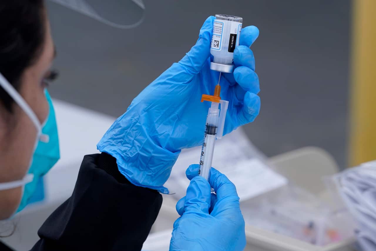 A healthcare worker prepares a Moderna COVID-19 vaccine in California, February, 2021.