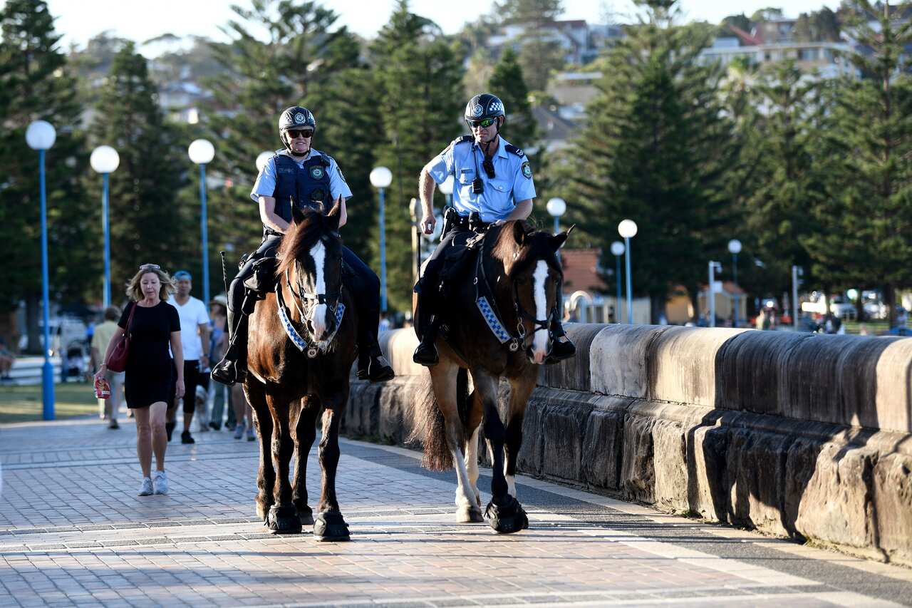 Mounted police are seen patrolling a closed Coogee Beach in Sydney on Friday. 