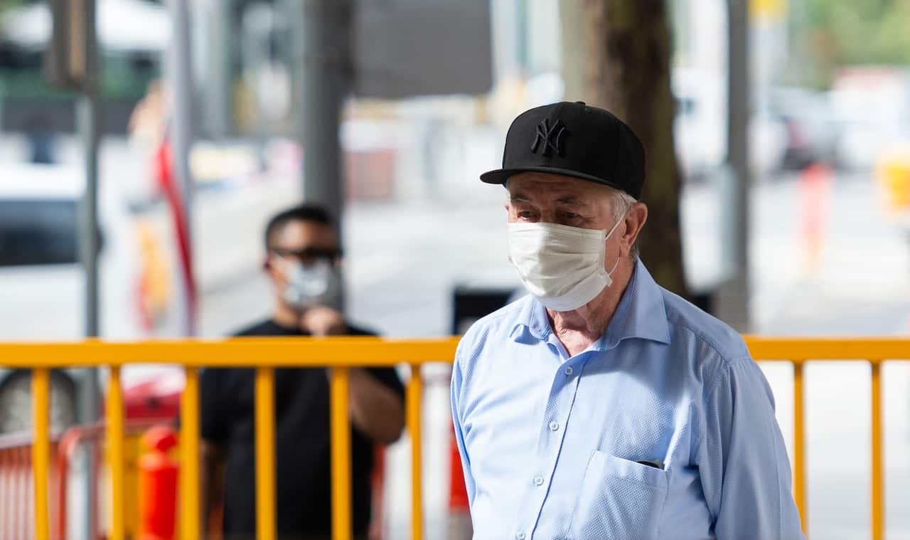 A man wears in mask in Melbourne earlier in the pandemic.