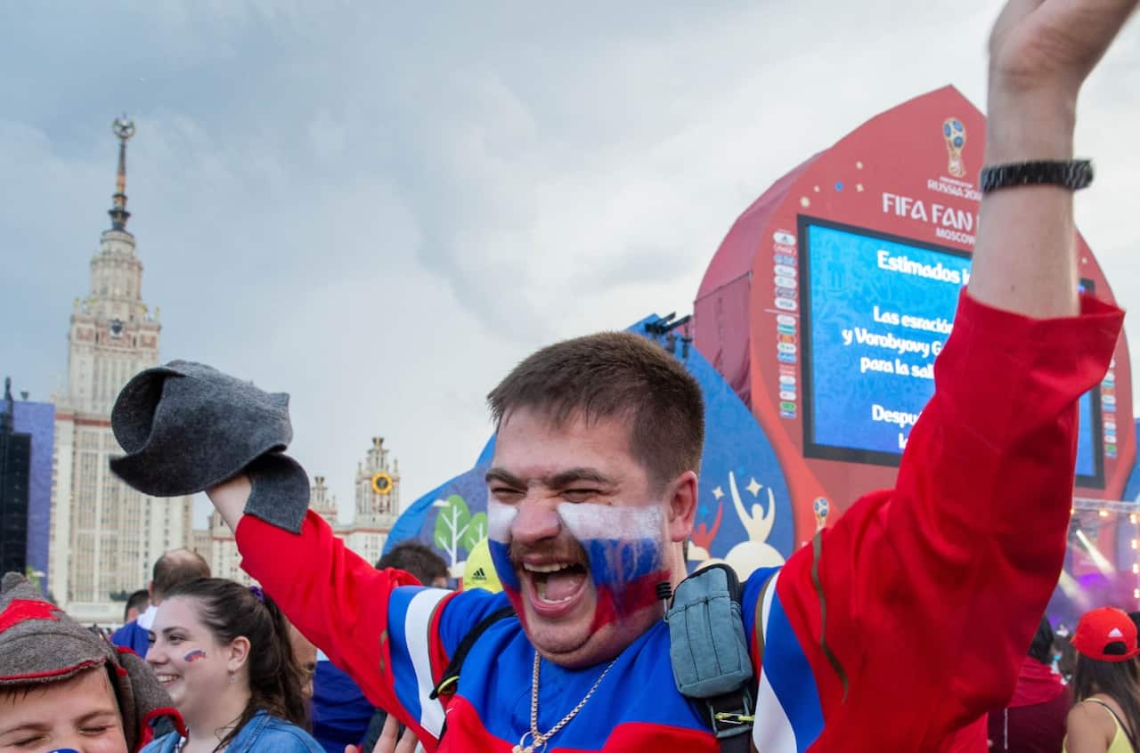 Russia fans celebrating in the fan zone in Moscow their victory over Spain in their last 16 match in the 2018 Russia World Cup.