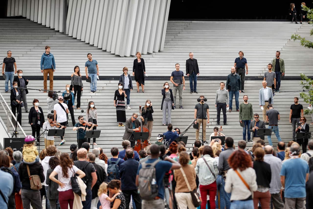 A classic orchestra performs live outside the Philharmonie in Paris as part of France's annual music festival.
